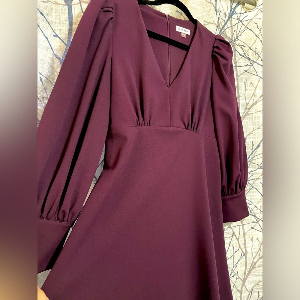 Calvin Klein size 10 knee length long sleeve dress. Button detail on sleeve
